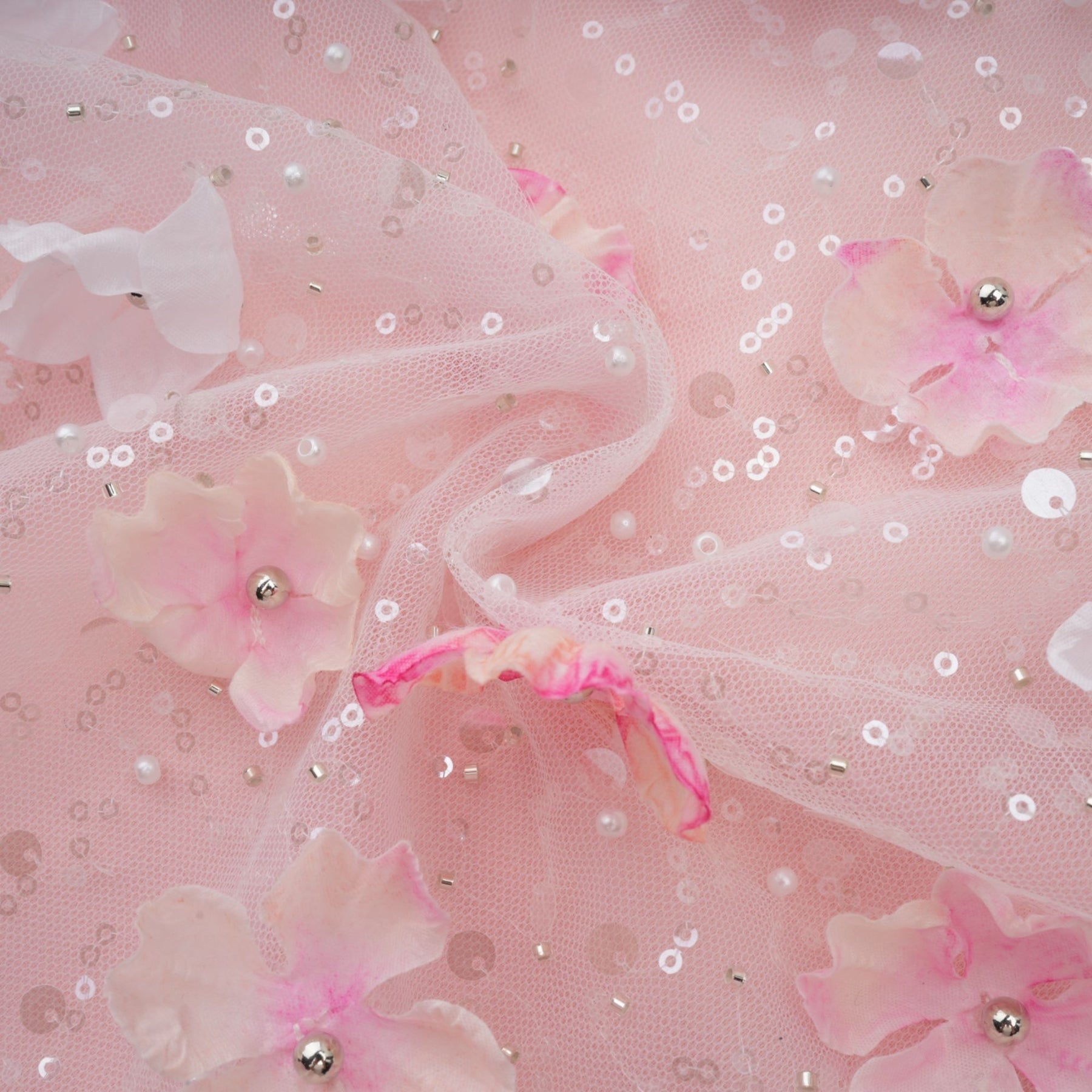 A short puffy mini dress with threedimensional petal details covering the fabric creating a textured floral effect