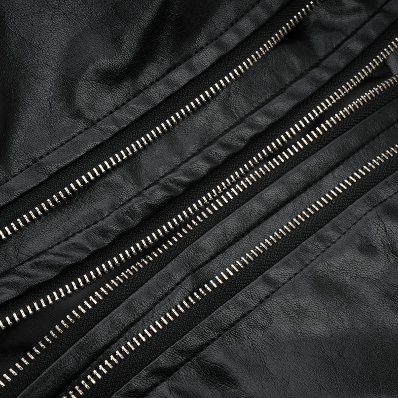 A short quilted leather jacket in brown color with a collar and zipper closure