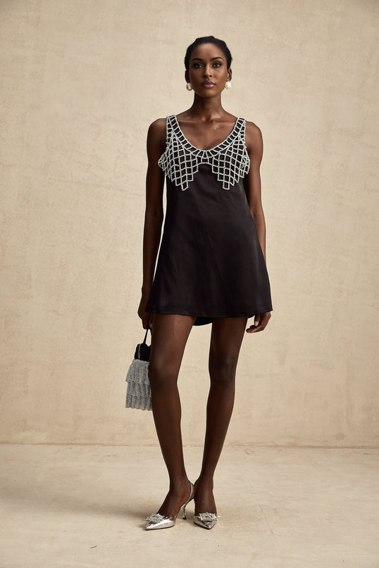 A short sleek satin mini dress adorned with sparkling crystal embellishments named Leonore