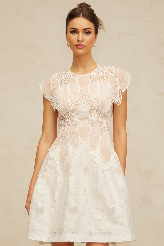 A short white mini dress with 3D floral lace details featuring a corded lace pattern and textured petal embellishments