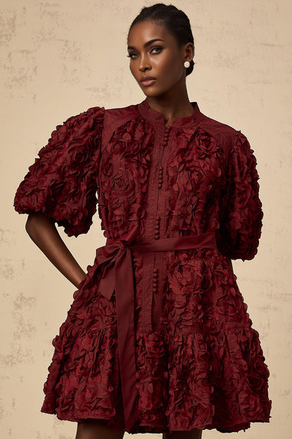 A short winered mini dress with 3D petal puff details named Segolene