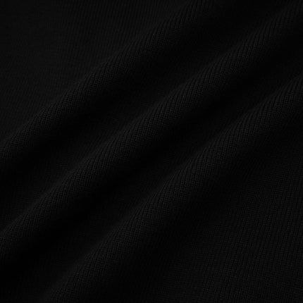 A short wool dress with color block design and ribbed knit texture featuring a mini length and contrasting panels in different colors