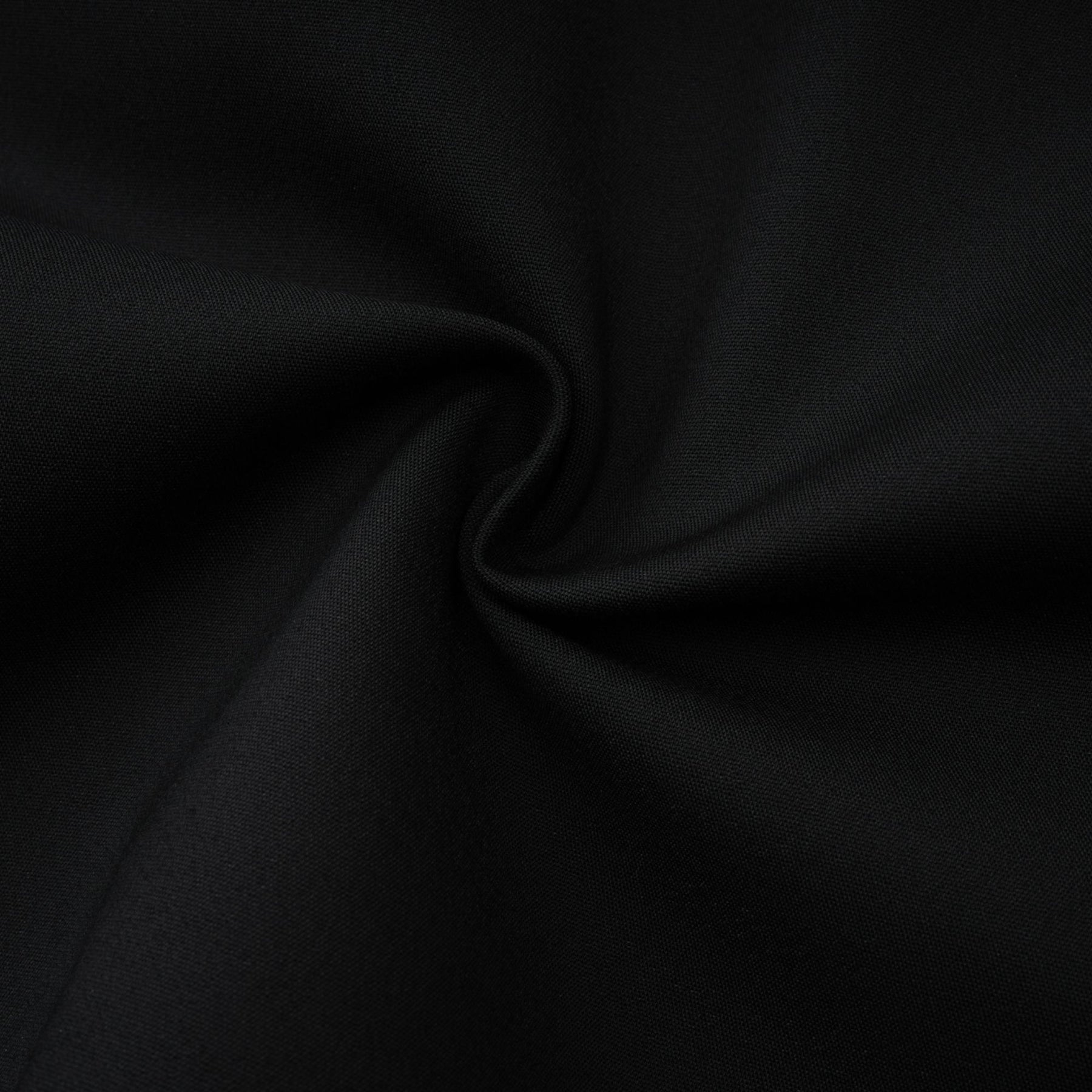 Sleeveless black dress with Vneck boned bodice flap pockets and organic cotton composition