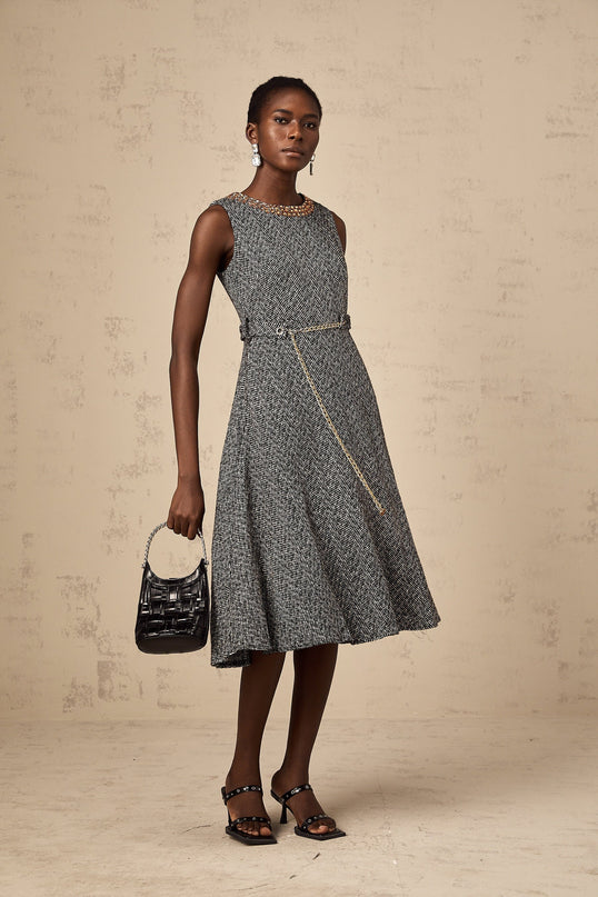 A sleeveless grey tweed midi dress with crystal embellishments suitable for Valentines Day featuring a fitted silhouette and subtle sparkle details