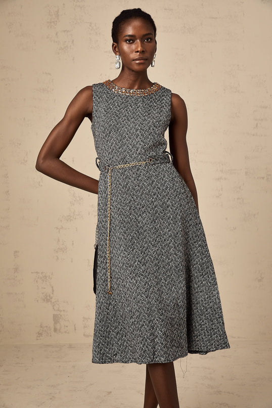 A sleeveless grey tweed midi dress with crystal embellishments suitable for Valentines Day