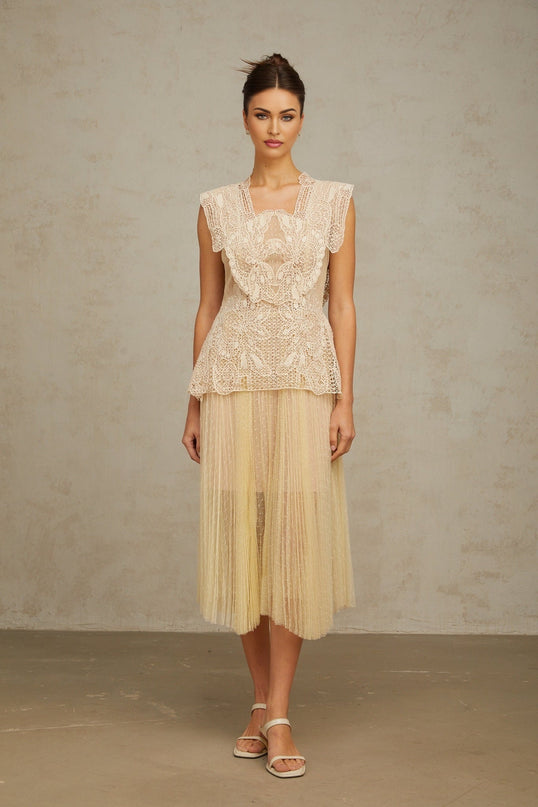 A sleeveless midi dress with floral lace panels and tulle fabric in neutral tones featuring a fitted bodice and flowy skirt