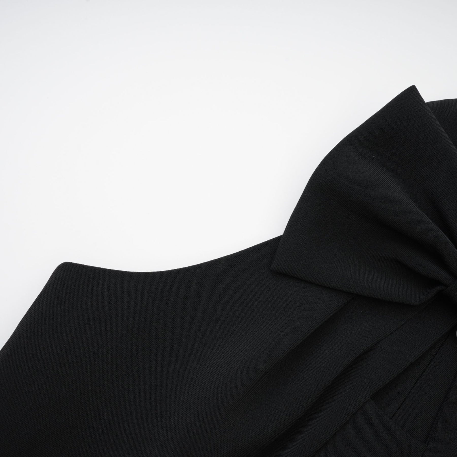 Black sleeveless dress with a cutout design and bowknot embellishment made of 65% Viscose and 35% Polyamide