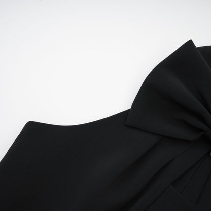 Black sleeveless dress with a cutout design and bowknot embellishment made of 65% Viscose and 35% Polyamide