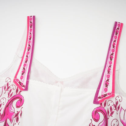 Pink sleeveless mini dress with sweetheart neck and allover graphic print styled with a flared skirt and zip fastening