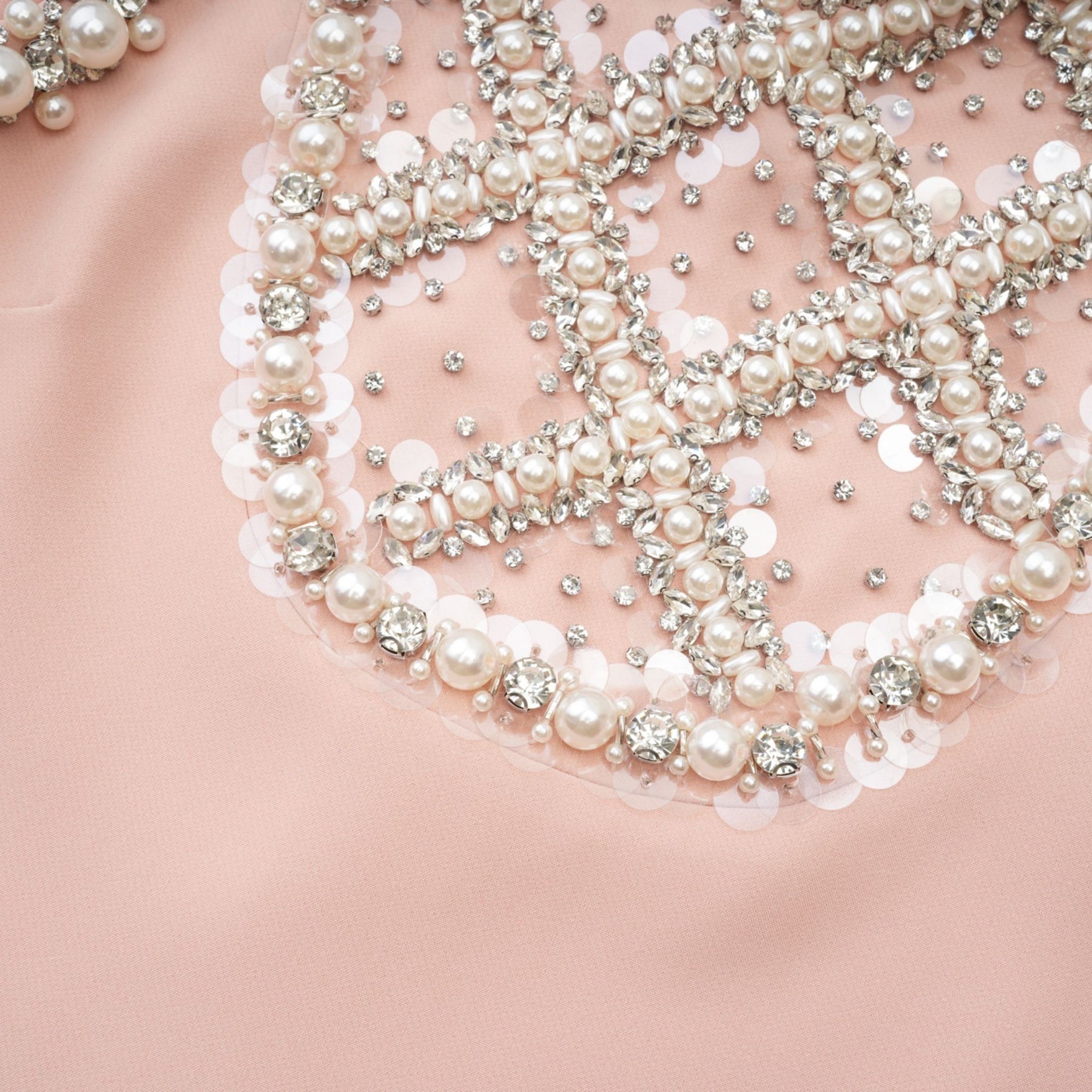Pink sleeveless dress featuring crystal and faux pearl embellishments round neckline rear button fastening thigh length 80% Polyester and 20% Cotton