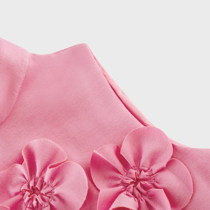 A sleeveless pink maxi dress with a bow and decorative artificial flowers called Magali