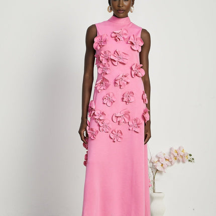 A sleeveless pink maxi dress with a bow and decorative artificial flowers named Magali