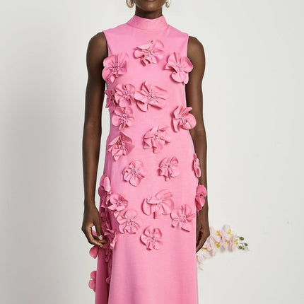 A sleeveless pink maxi dress with a bow and decorative artificial flowers named Magali