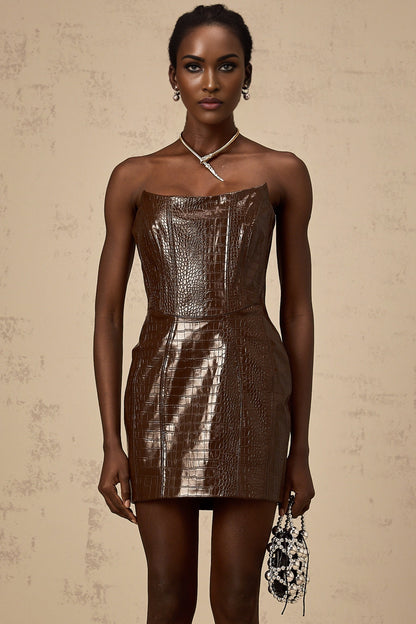 A small brown mini dress made of textured leather featuring a simple design and short length