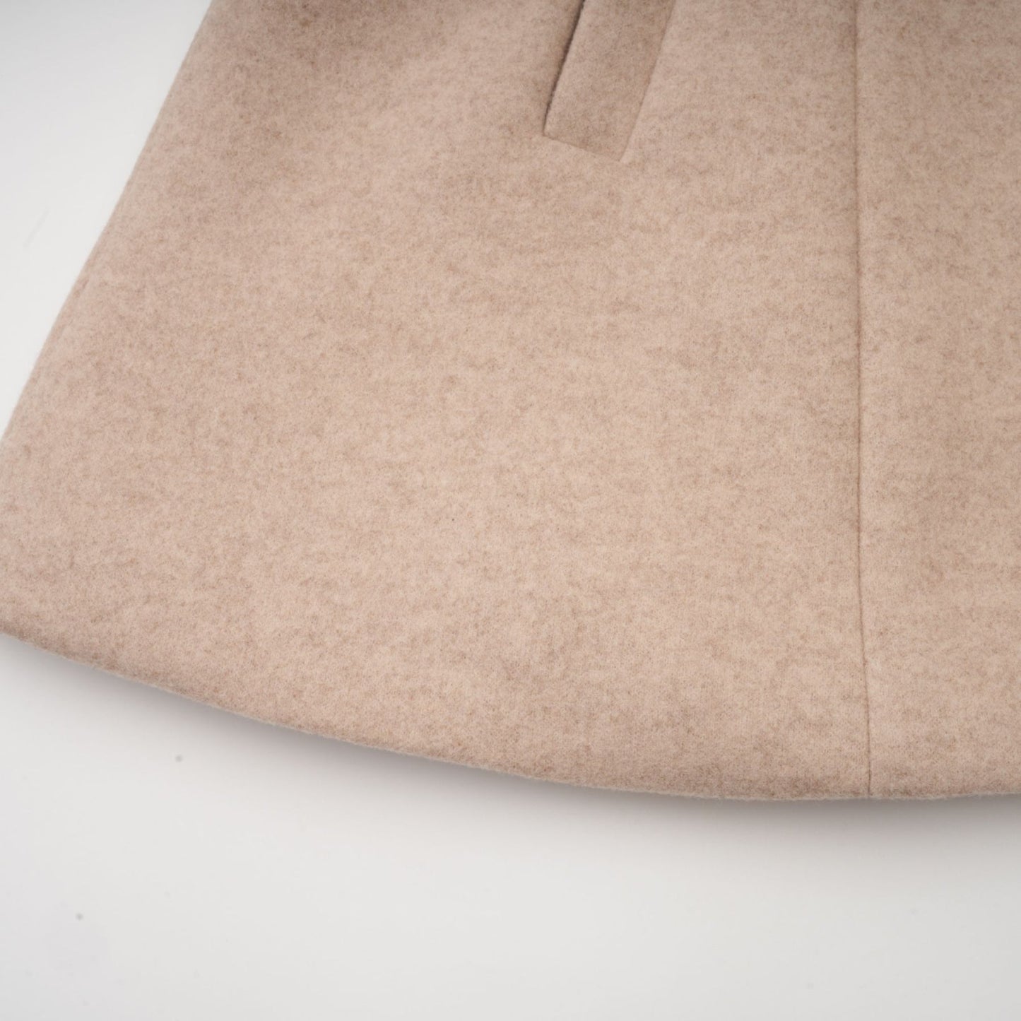 A stylish coat with a detachable cape featuring faux fur in a rosella color