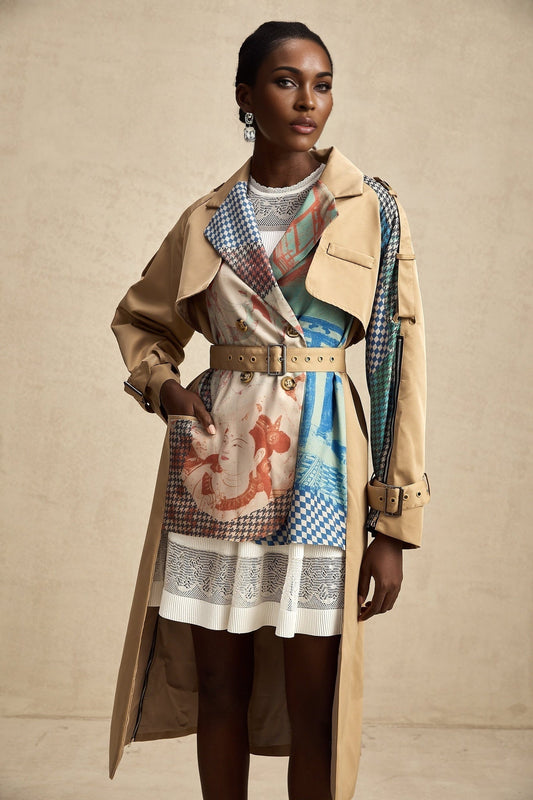 A stylish trench coat featuring contrasting color details and a printed design with a belt cinching the waist The coat is named Josephine and combines classic trench elements with modern flair