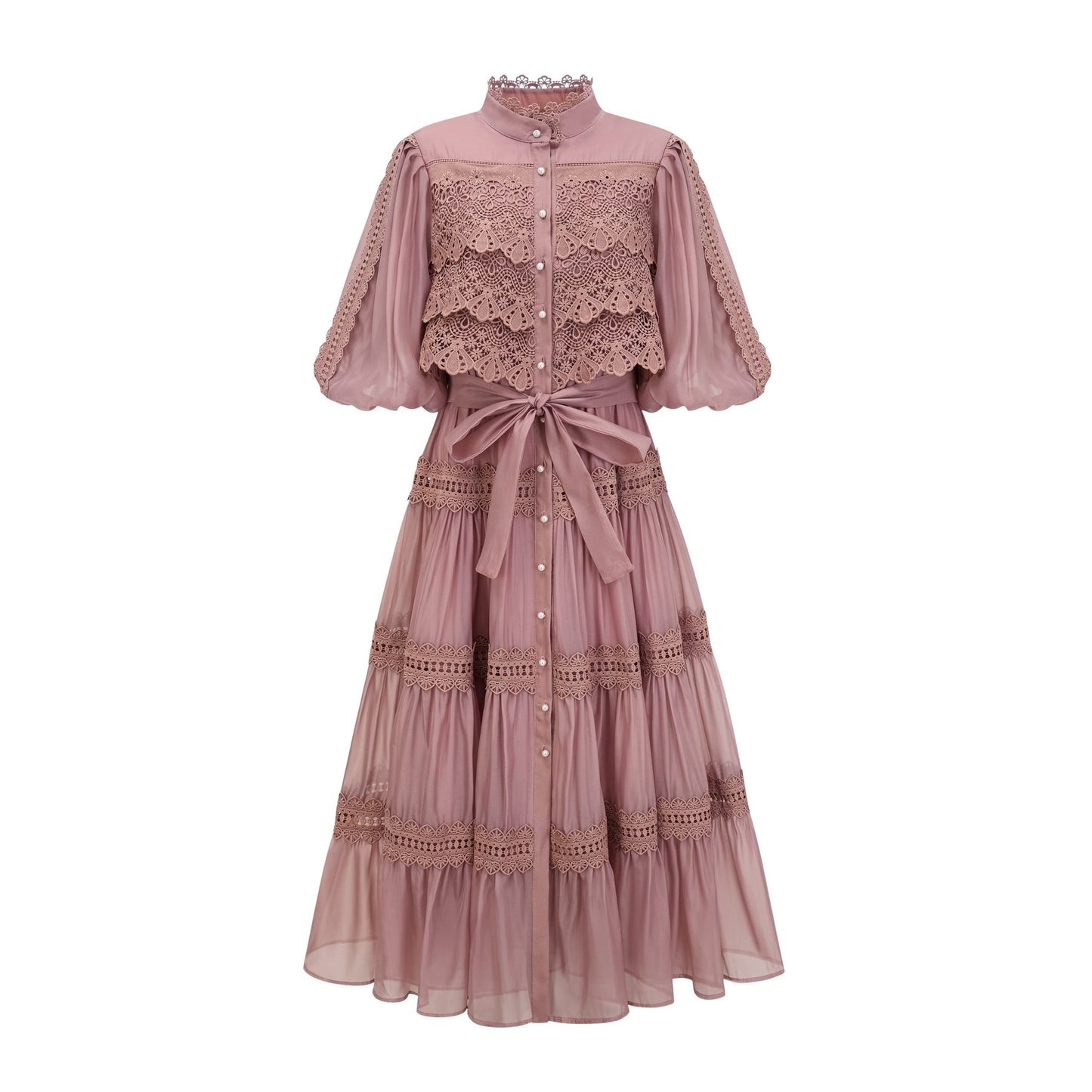 A tiered midi dress with lace cutouts featuring a light and airy design in white or cream color with intricate patterns and a flowy silhouette