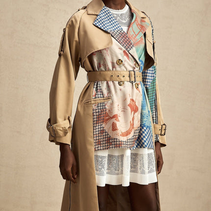 A trench coat with contrasting colors and a printed design featuring a belt at the waist named Josephine