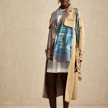 A trench coat with contrasting colors and a printed design featuring a belt cinched at the waist named Josephine