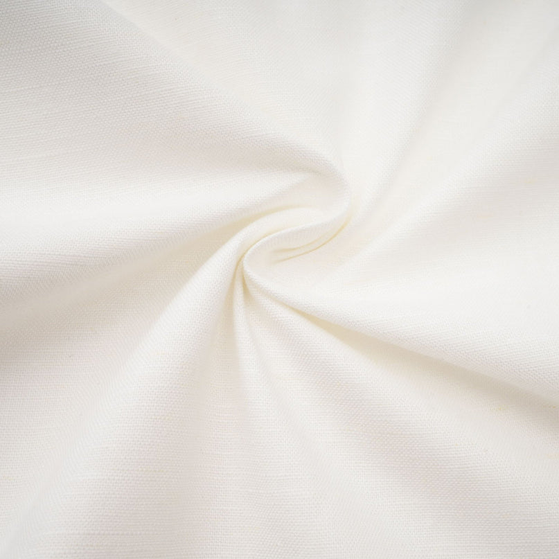 A white corsetstyle midi dress with a fitted bodice and flared skirt worn by a model standing against a plain background