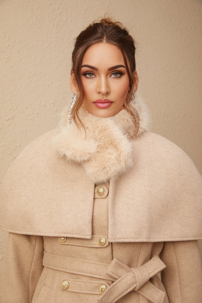 A white faux fur coat with a detachable cape collar featuring a vibrant red rosella bird pattern
