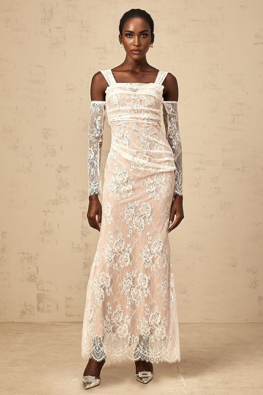 A white floor length maxi dress with a corset style bodice featuring ruched floral lace detailing and thin straps
