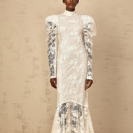 A white floorlength mermaid style dress with floral lace details and a fitted silhouette named Pauline