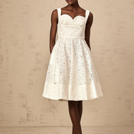 A white floral lace midi dress with delicate patterns and intricate details named Nicolette
