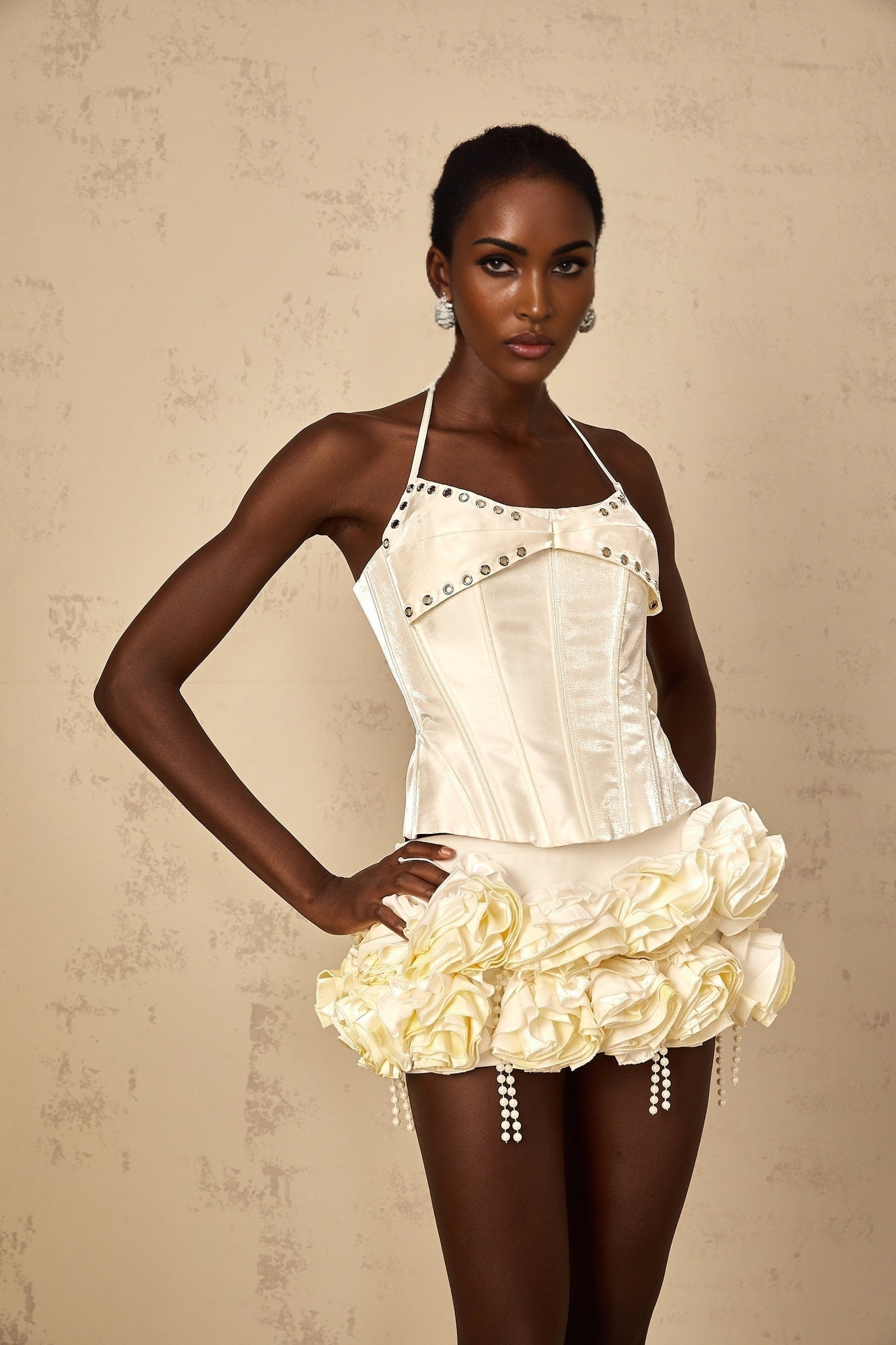 A white floral matching set featuring a corset top and skirt with Madeleine style design The outfit has a delicate floral pattern on a white background The corset top is fitted with a structured bodice while the skirt complements the ensemble