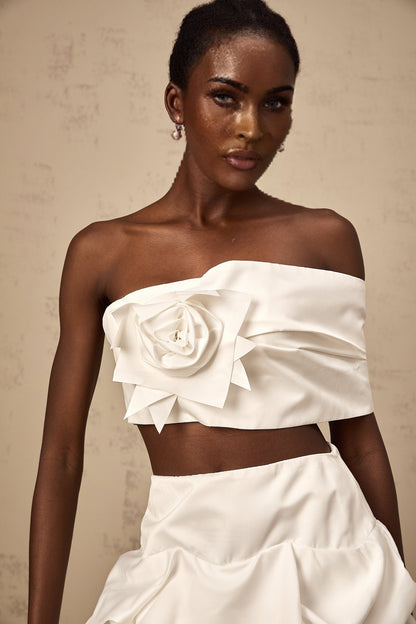 A white floral printed matching set featuring a pleated top and skirt from Honorine with delicate patterns and feminine design