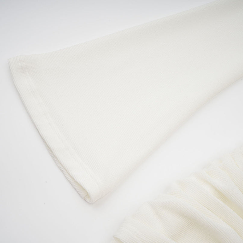 A white knit maxi dress with glittered floral appliques named Wanda