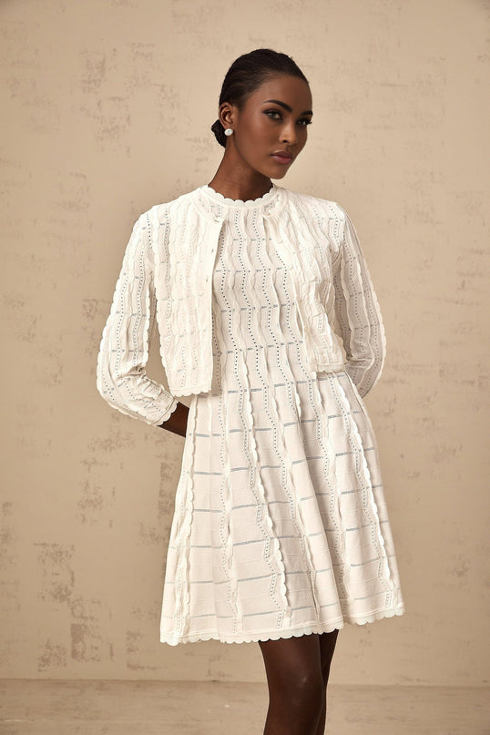 A white knitted cardigan with ruffled details named Esmee