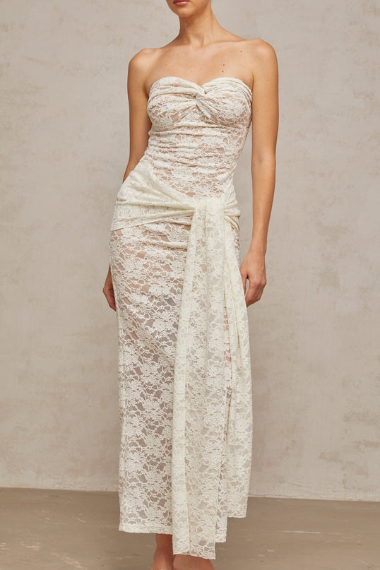 A white lace midi dress with draped detailing named Wilhelmine