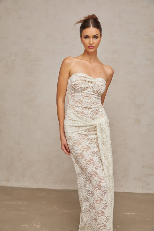 A white lace midi dress with draped details and a feminine silhouette named Wilhelmine