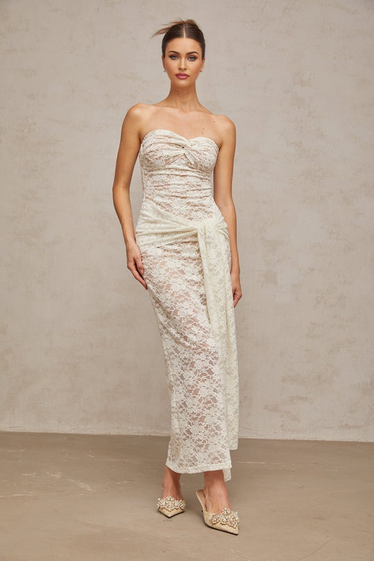 A white lace midi dress with draped details and feminine design named Wilhelmine