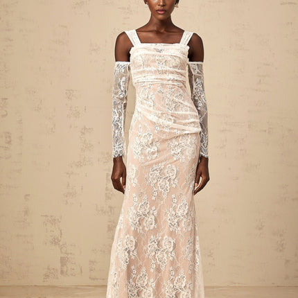 A white maxi dress featuring a floral lace corset bodice with ruched detailing and a flowing skirt
