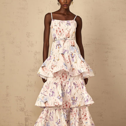 A white maxi dress with a floral print pattern featuring ruffled tiers and a long flowing skirt suitable for women