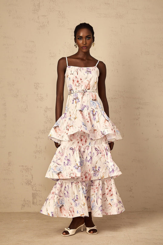 A white maxi dress with a floral print pattern featuring ruffled tiers and a long flowing skirt suitable for women