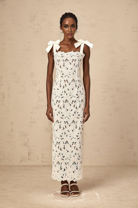 A white maxi dress with floral embroidery details named Eloise