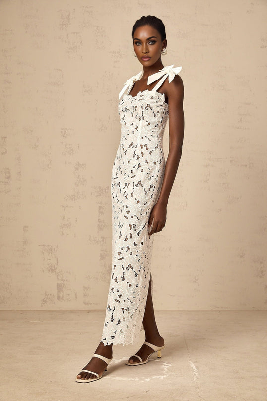A white maxi dress with floral embroidery details named Eloise