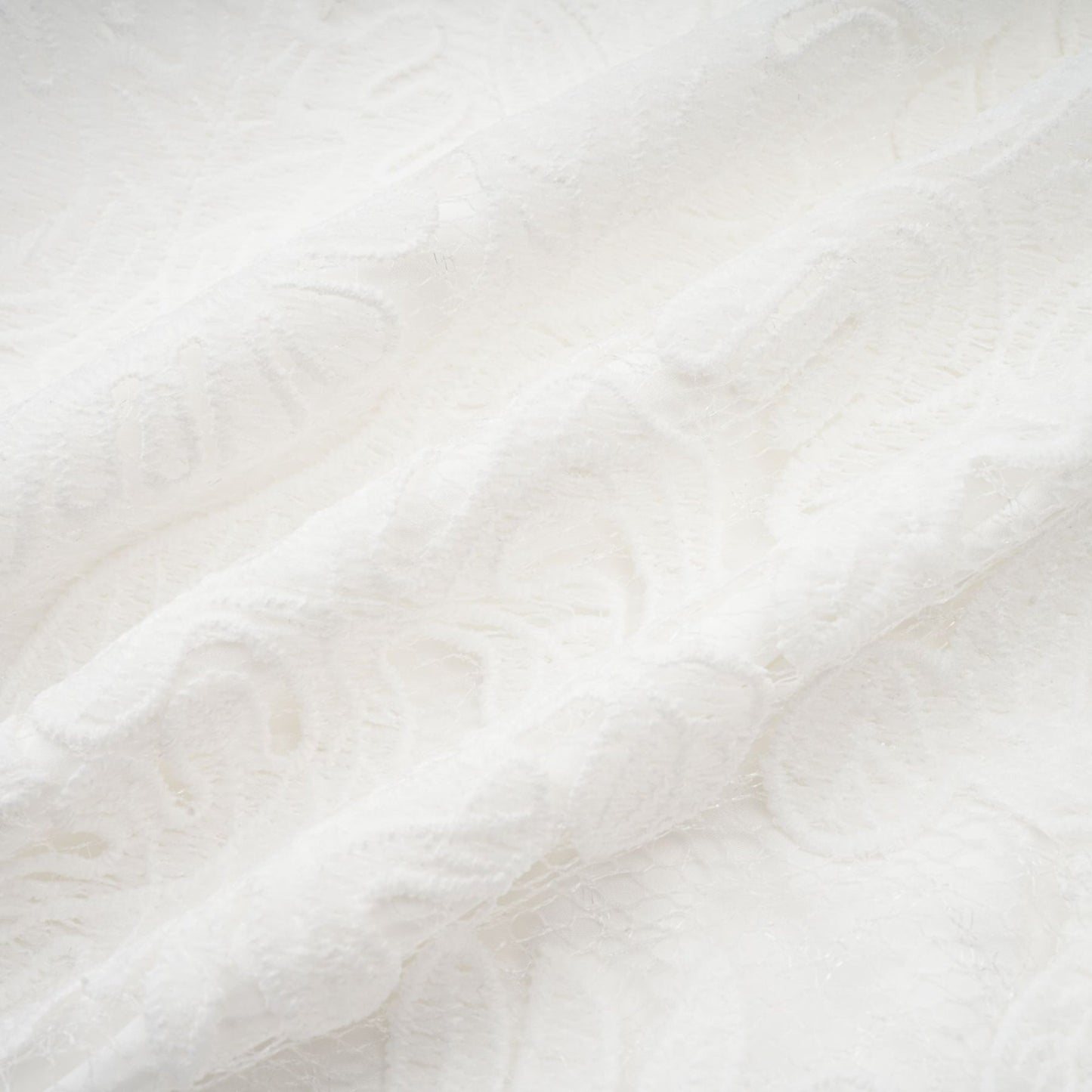 A white midi dress featuring panelled design and delicate embroidery details named Madeleine
