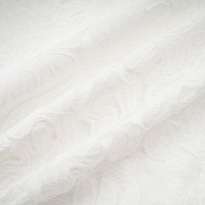 A white midi dress featuring panelled design and delicate embroidery details named Madeleine
