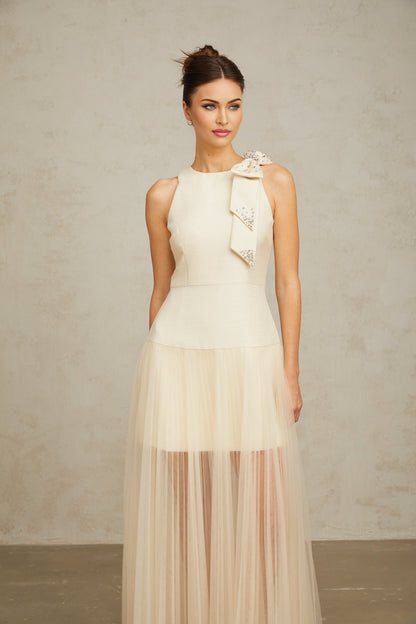 A white midi dress with a bow detail and tulle panels named Therese