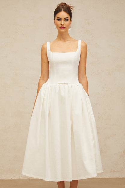 A white midi dress with a bowknot detail and flounced design named Perrine