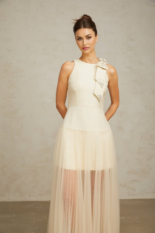 A white midi dress with a bowknot detail and tulle panels named Therese