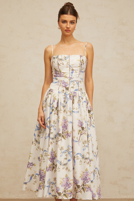 A white midi dress with a floral print pattern featuring a design called Fleur