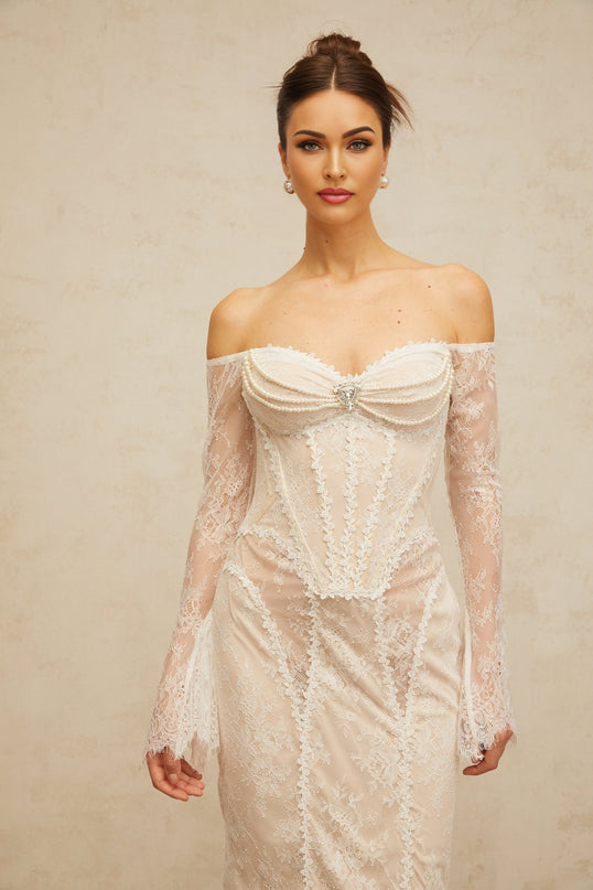 A white midi dress with floral lace embellishments named Enora