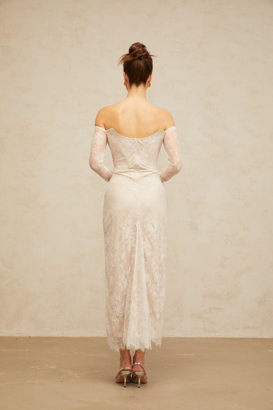 A white midi dress with floral lace embellishments named Enora