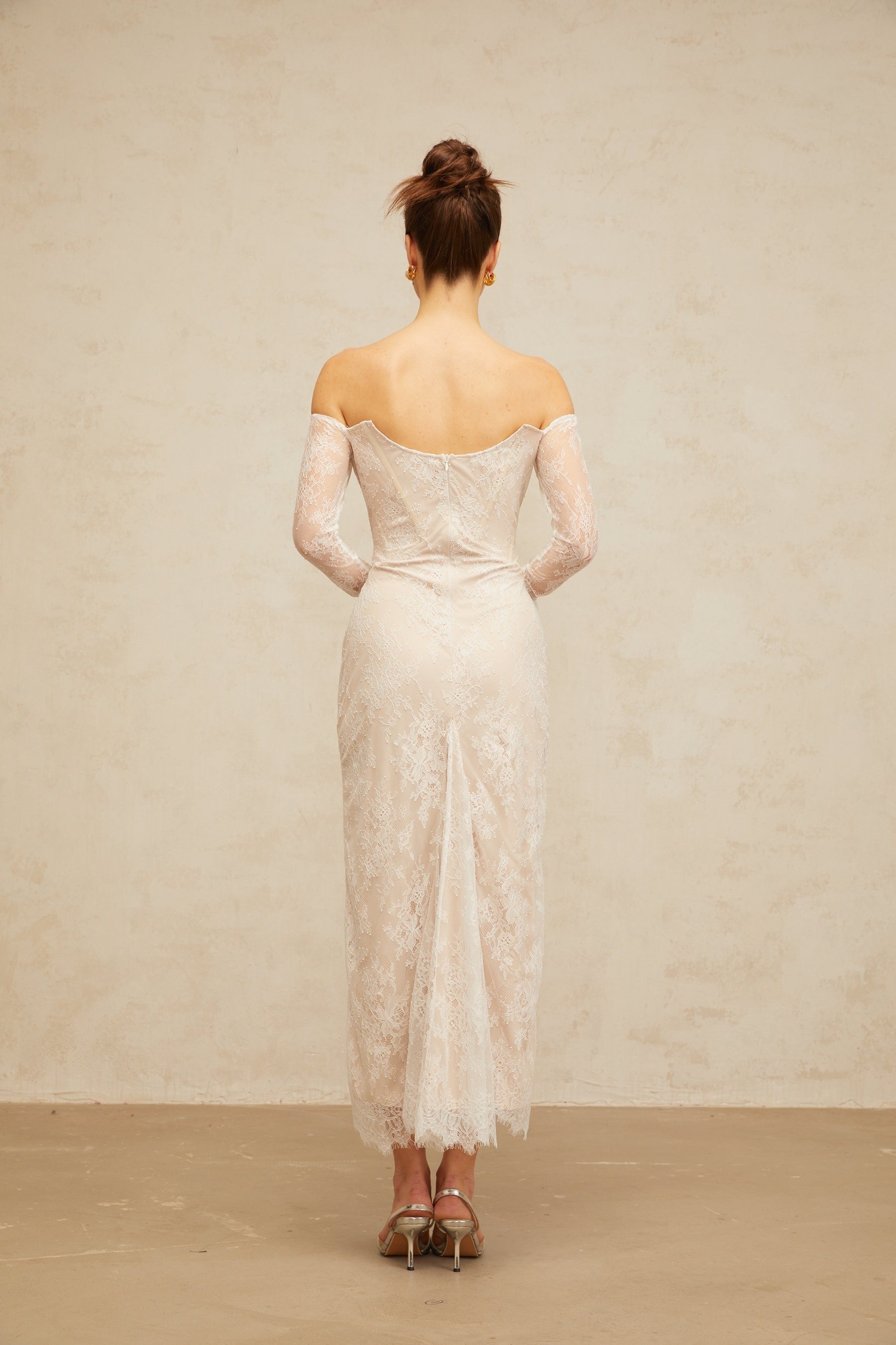 A white midi dress with floral lace embellishments named Enora