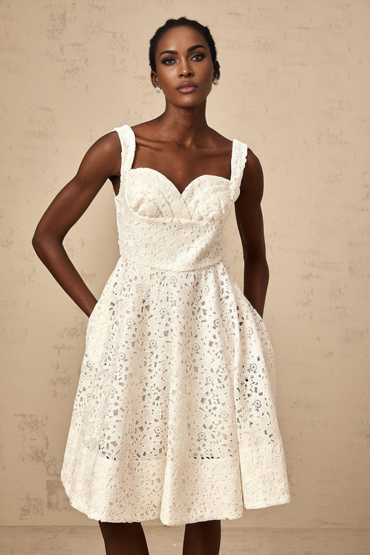 A white midi dress with floral lace pattern Nicolette style featuring delicate details and a feminine silhouette